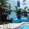 seating by a pool in front of a mural